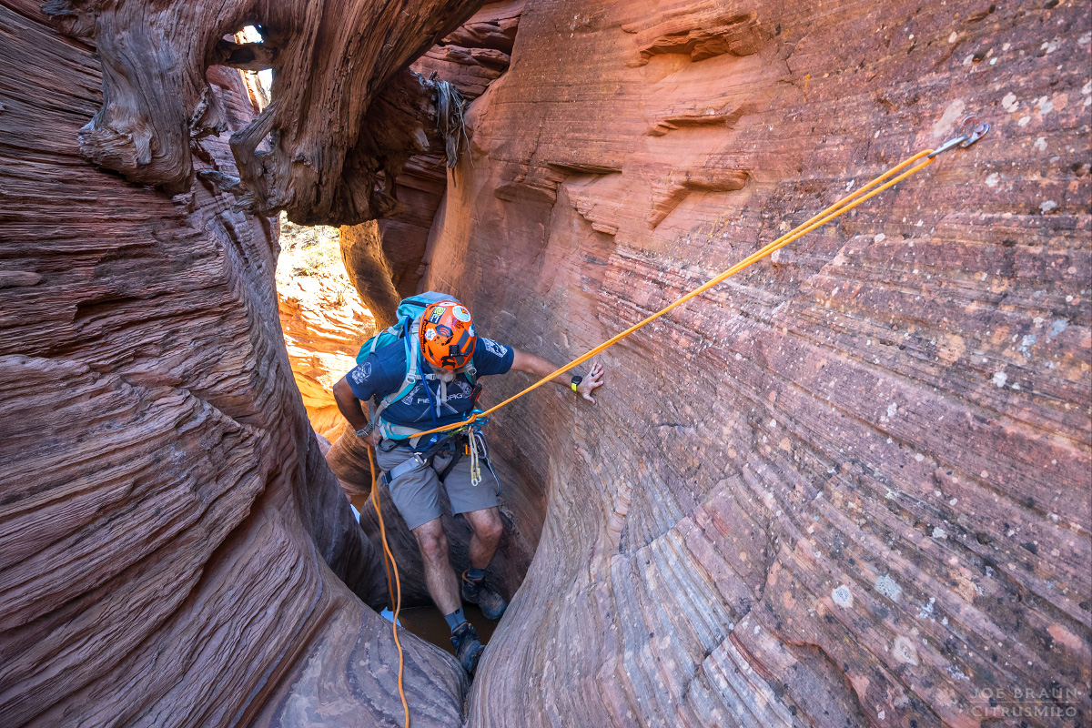 Rappelling into the double toilet bowls of Rock Canyon (Zion National Park) -- &copy; 2023 Joe Braun Photography